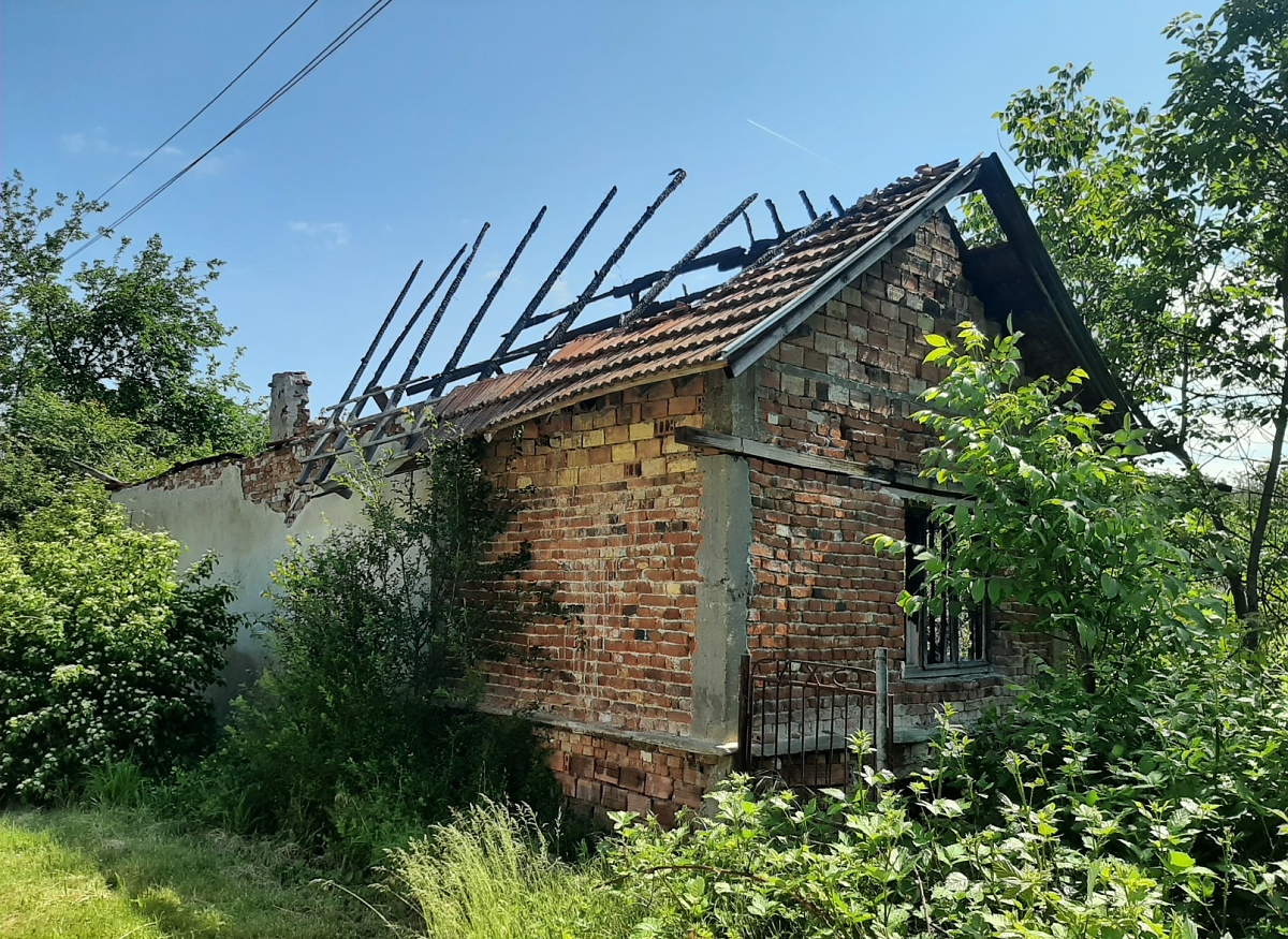 /plot-of-land-with-damaged-rural-house-situated-in-proximity-to-forest-and-hills/